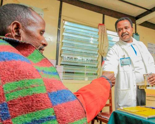 A health worker gives medication to a patient.  Kenya has embarked on a extensive evidence-based approach to root out TB 